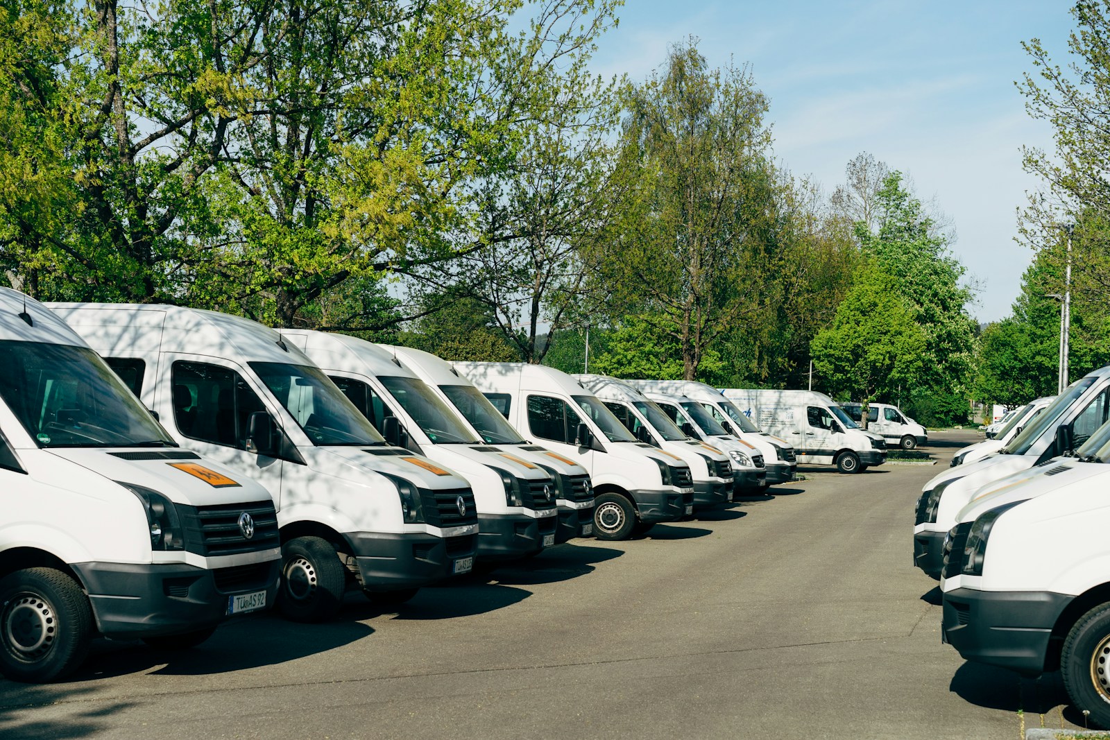 cars with commercial auto insurance parked on parking lot during daytime