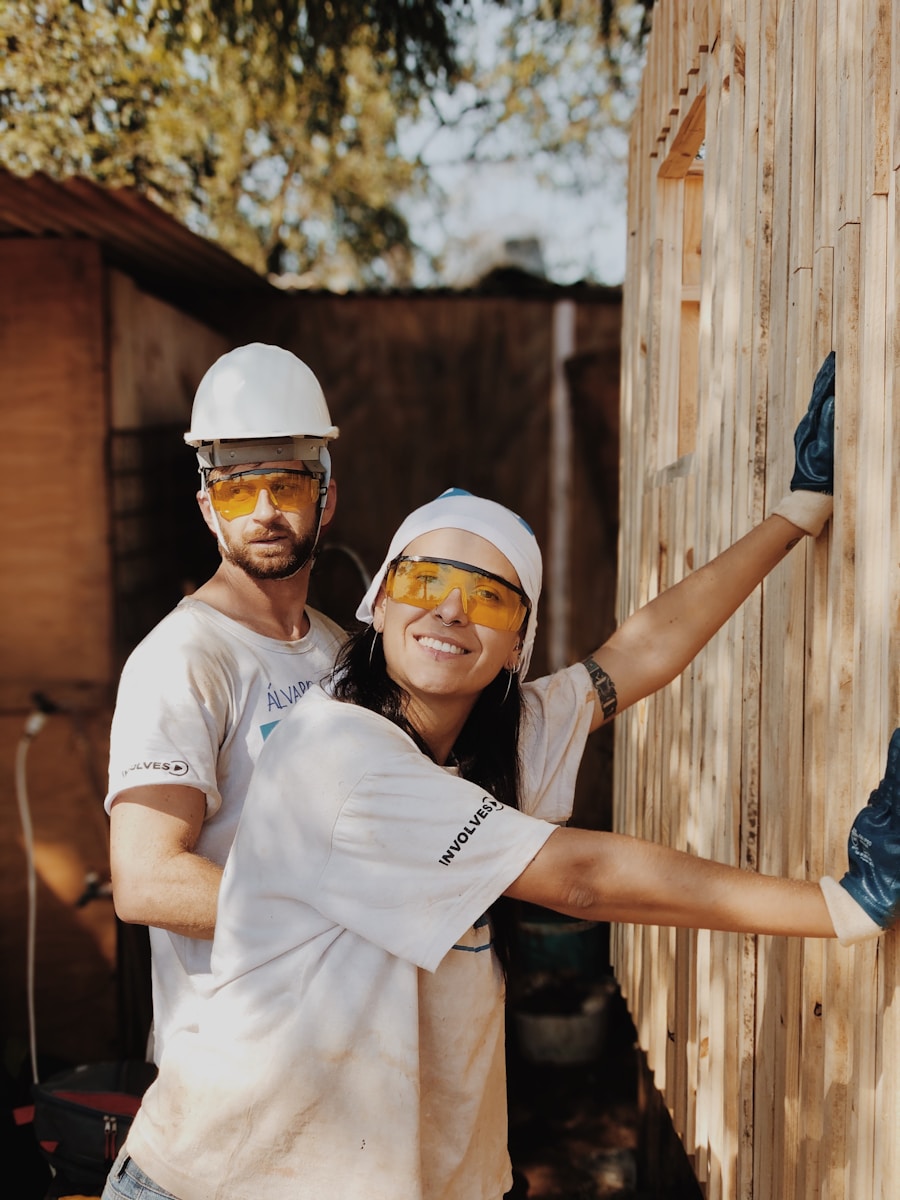 woman in white shirt wearing white helmet with employers liability insurance