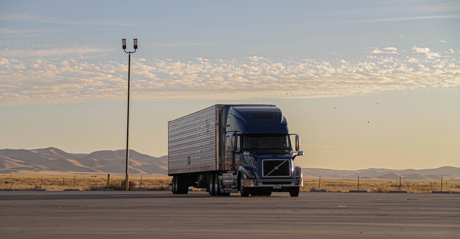 black truck with commercial trucking insurance on road during daytime